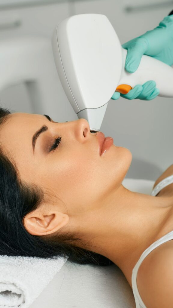 Facial laser hair removal. Beautiful woman during laser hair removal and laser epilation to lips area on her face