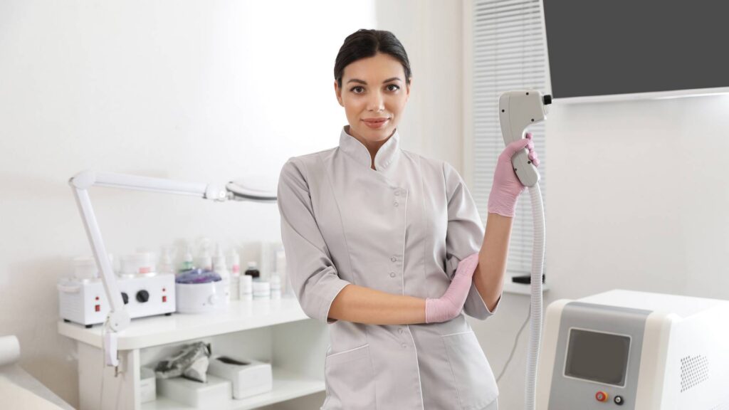 Young Woman Holding Professional Laser Epilator in Beauty Salon