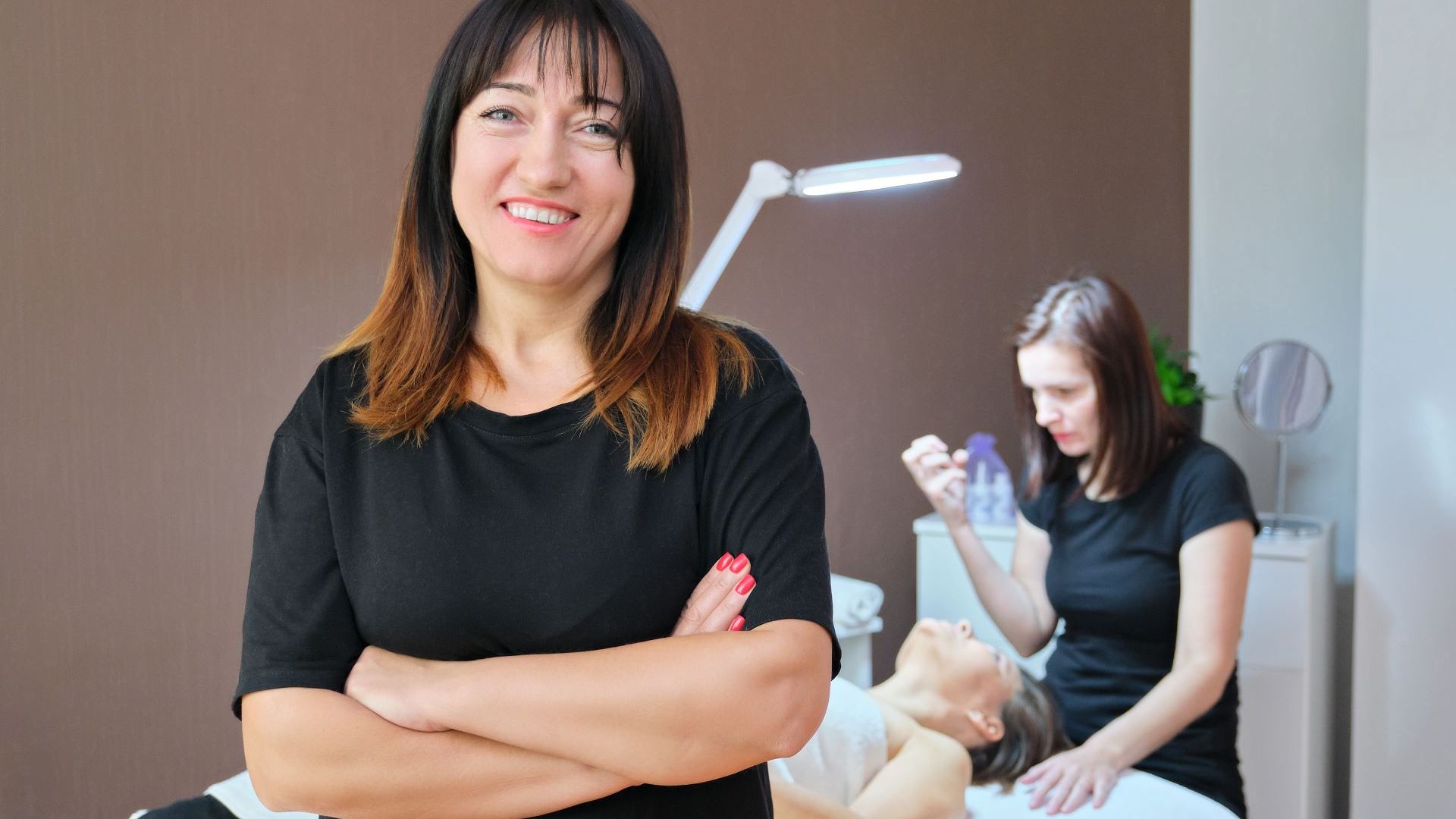 cosmetologist instructing a new nurse cosmetologist