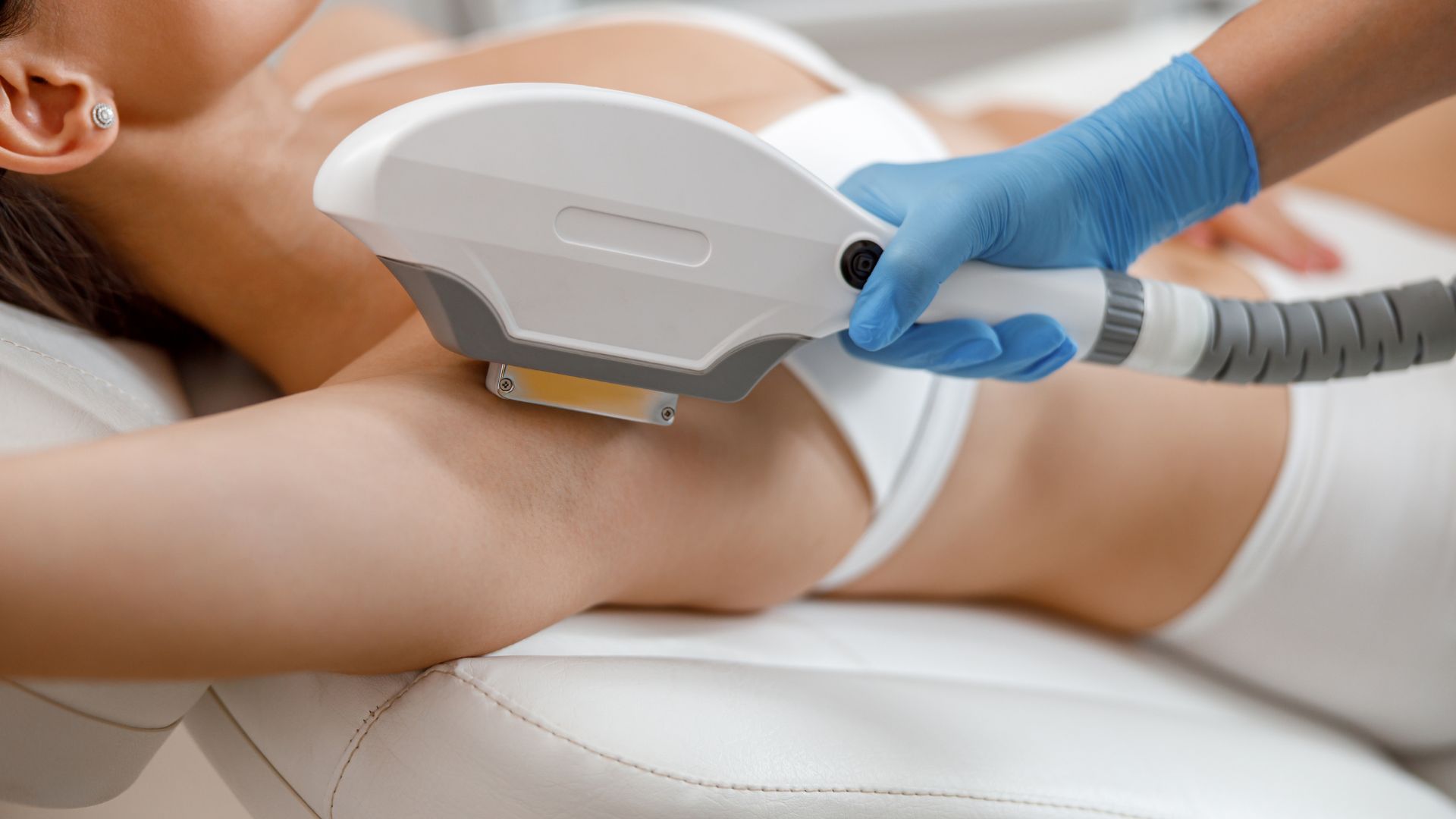 Closeup of Armpit Hair Laser Removal Procedure with Ipl Machine in a Beauty Salon. IPL vs Laser Hair Removal