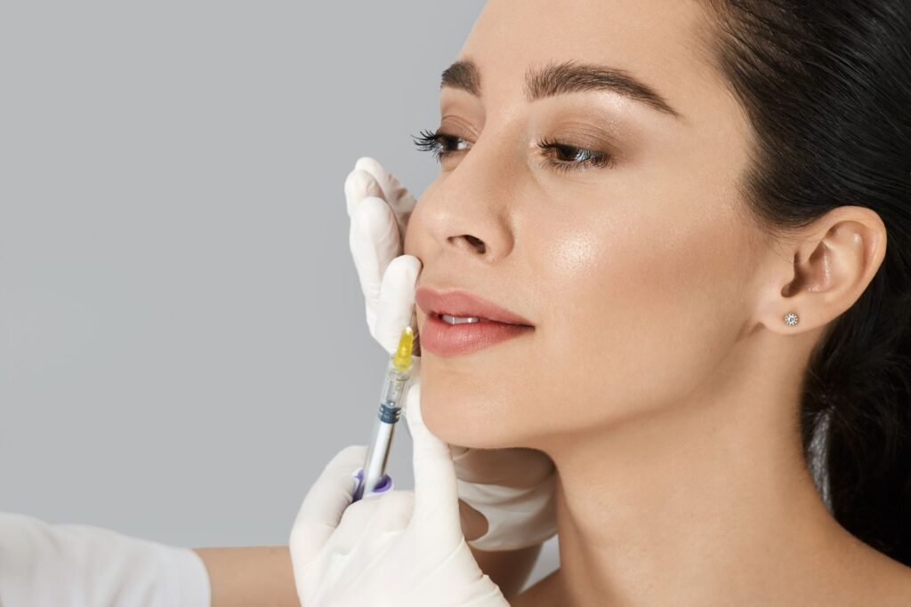 Beautician performing lip filler injection for augmentation, related to lip filler cost considerations